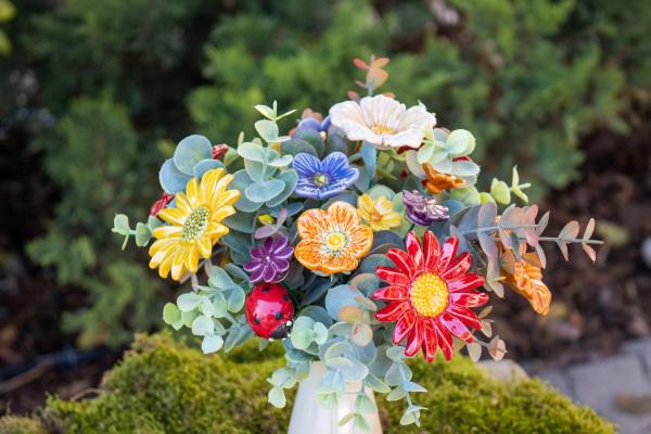 Artistic handmade ceramic flowers in mixed colors