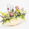 Ovale Tischdekoration - Lila Blumen