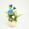 Kleine Tischdekoration mit Gartenmohnblume
