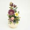 Kleine Tischdekoration mit Gartenmohnblume