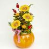 Große Kürbistopf-Tischdekoration mit Dekosonnenblumen